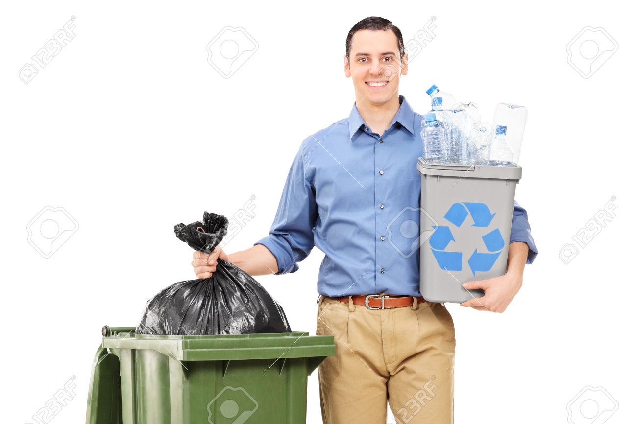 Man holding a recycle bin by a trash can